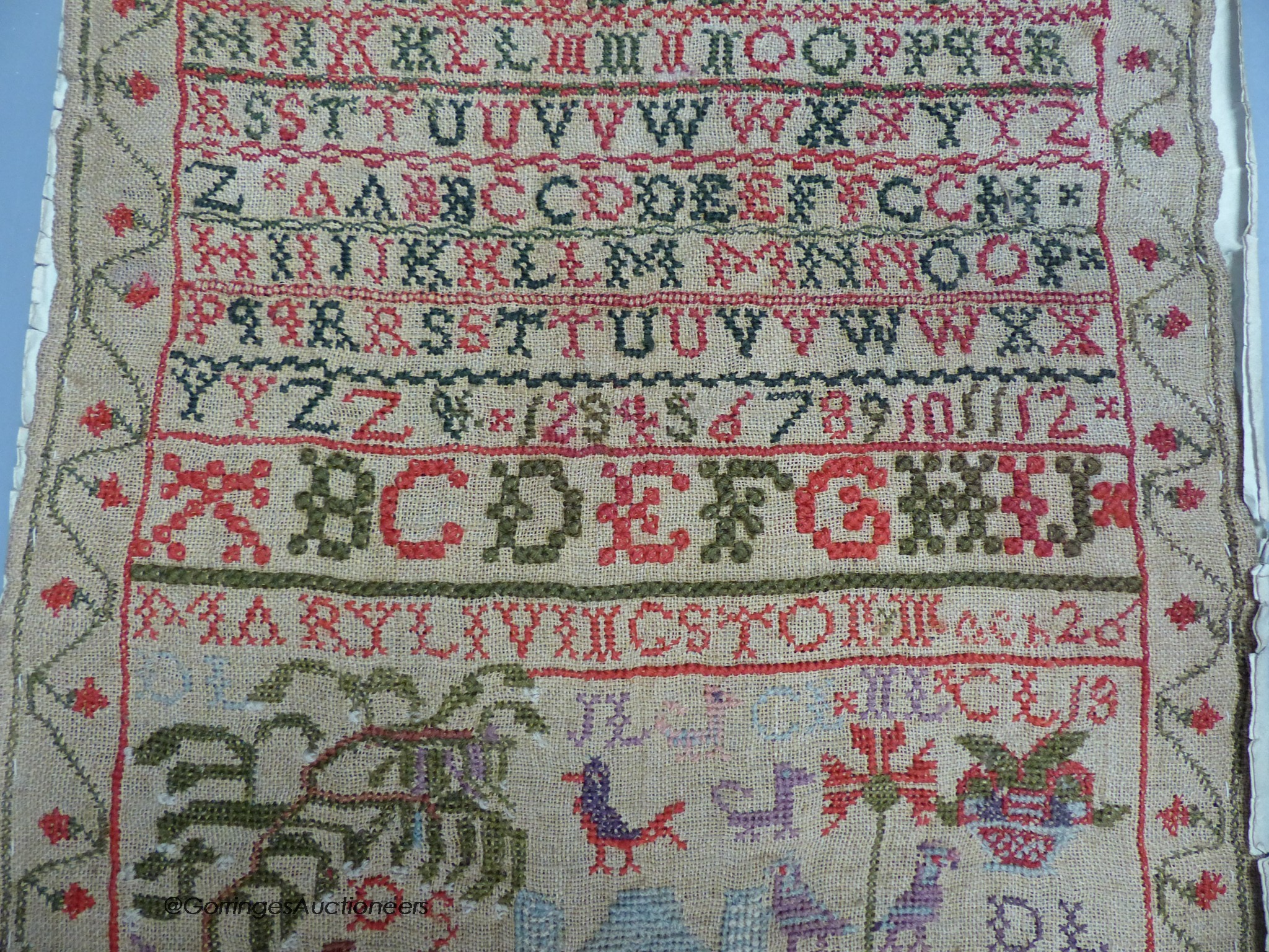 A cross stitch sampler, 41cm high, 29.5cm wide